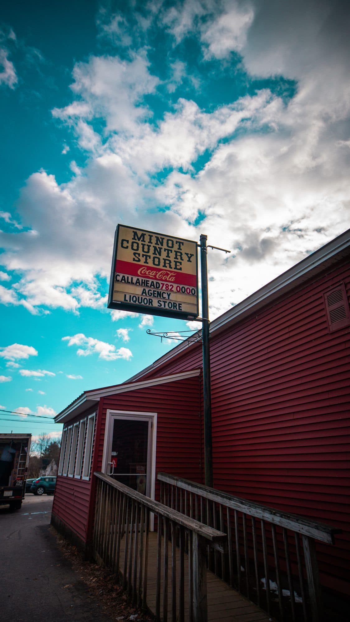 The Minot Country Store sign against a bright blue sky