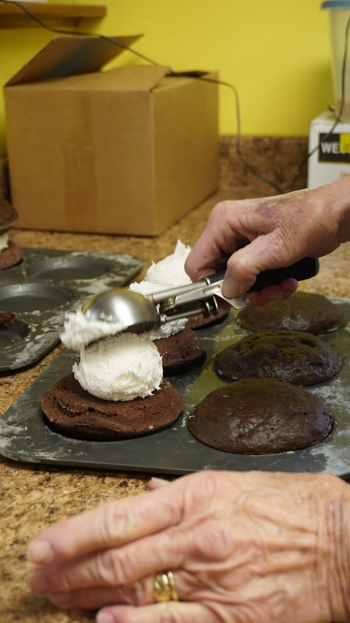 Filling homemade whoopie pies by hand